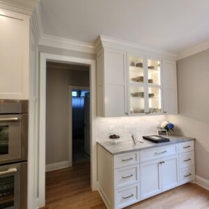 Organized pantry with labeled containers on wooden shelves in Raleigh, NC